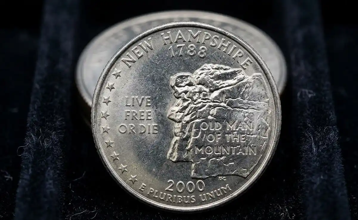 close-up of an Old Man of the Mountain quarter coin